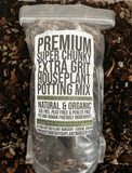 Bag of premium houseplant potting mix with a label on a soil background