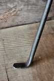 Wood Stove Fire Poker on a wooden surface