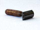 Manual razor with wooden handle on a white background