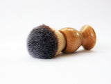 Shaving brush with wooden handle on a white background