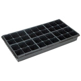 Black plastic seed tray with multiple compartments on a white background