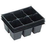 Stack of black plastic seedling trays on a white background