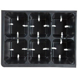 Black plastic seed tray with multiple compartments on a white background