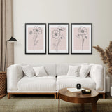Modern living room with a white sofa, wooden coffee table, and Pink Wall Art Set Of 3 Botanical Modern Decor