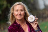 Woman holding a jar of LAVENDER THYME ARNICA SOUFFLÈ 8 oz.