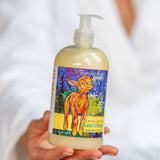 Person holding a bottle of Appalachian Goat Creamery lemon verbena goats milk soap.