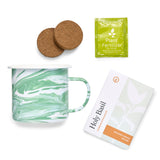 Green marbled mug with cork coasters, plant fertilizer packet, and organic seeds packaging on a white background Altered Herb Mug Grow Kits