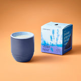 Blue candle in a textured container with a matching box on an orange background Garden Vibes Candle/Planter 2-in-1