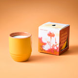 Yellow candle in a textured container with a box labeled 'last light' on an orange background Garden Vibes Candle/Planter 2-in-1