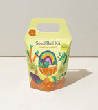 Seed ball kit packaging with colorful design on a light background