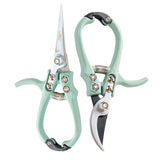 Two pairs of garden shears with light green handles on a white background