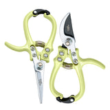 Pair of garden shears with green handles on a white background