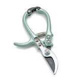Gardening shears with light green handles on a white background