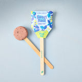 Sweet Basil seed pop on a stick with packaging against a gray background