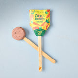 Seed pop with carrot-themed packaging on a light blue background