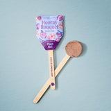 Seed pop with floral packaging and wooden stick on a light blue background Seed Pops - Flowers