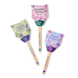 Three decorative seed pops with colorful designs and text on a white background Seed Pops - Flowers