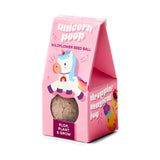 Pink packaging of unicorn poop wildflower seed ball with a cartoon unicorn on a white background Magical Plops