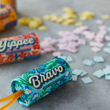 Bravo seed confetti popper with colorful confetti on a gray surface