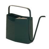 Green watering can on a white background