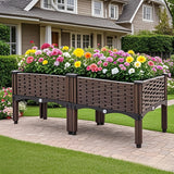 Wooden planter box with colorful flowers in front of a house