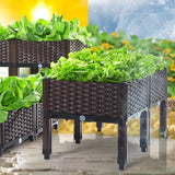 Brown woven planters with green plants against a blurred outdoor background