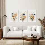 Living room with a white sofa, wooden coffee table, and Neutral Watercolor Wildflower Art Prints Set
