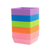 Stack of colorful 5X5 Shallow Microgreen Trays on a white background