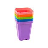 Stack of colorful square plastic planters on a white background