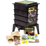 Black compost bin with gardening accessories on a white background