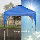 Blue pop-up canopy tent with sun-protection text, set against a clear sky.