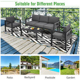 Outdoor furniture set with gray cushions on a deck, suitable for various outdoor settings.