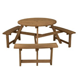 Wooden round picnic table with three matching benches on a white background