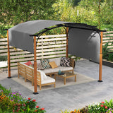 Outdoor gazebo with wooden furniture and canopy in a garden setting