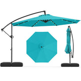 Turquoise patio umbrella with stand on a white background