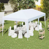 White gazebo set up with tables and chairs in a garden setting