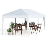 White outdoor canopy tent over a dining table with chairs and plants on a white background