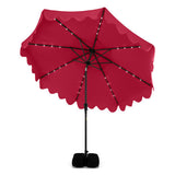 Red patio umbrella with black stand on a white background