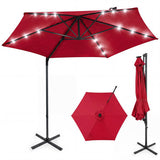 Red patio umbrella with stand on a white background