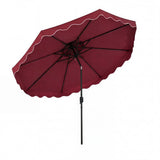 Red patio umbrella with scalloped edge on a white background