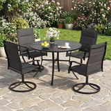 Outdoor patio set with a round table and four chairs on a stone patio.