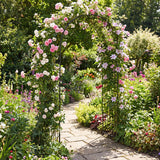 Floral archway in a garden with a stone path