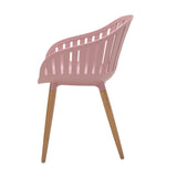 Pink chair with wooden legs on a white background
