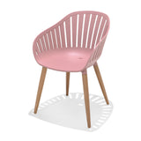 Pink chair with wooden legs on a white background