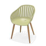 Green chair with wooden legs on a white background