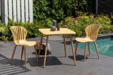 Outdoor patio set with wooden table and chairs by a pool