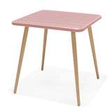 Pink table with wooden legs on a white background
