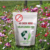 Bag of Earthwise Wildflower Mix with a 'No Deer Here' label in a field of wildflowers.