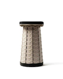 Textured stool with wavy pattern on a white background Nomad Seat | Sand Stone