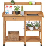 Wooden potting table with plants, cleaning supplies, and a basket on a white background